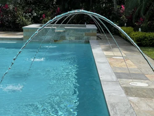 Close-up of geometric pool water spout features