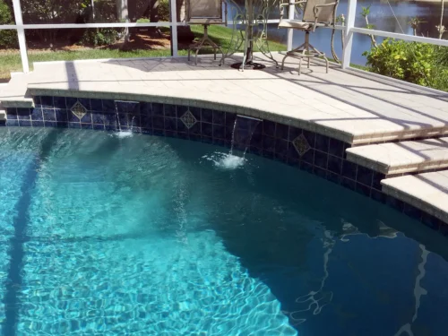 Close-up of water feature on custom built freeform pool
