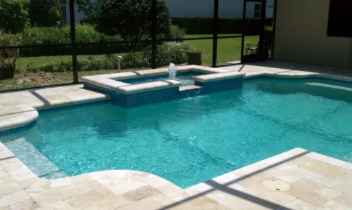 Custom built geometric pool with spillover spa & bubbler.