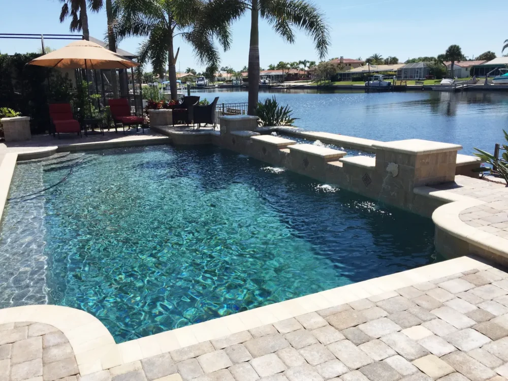 Custom built geometric pool with spillover water features.