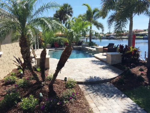 Custom built geometric pool with spillover water features.
