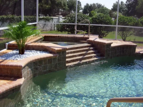 Custom built raised spillover spa and planter