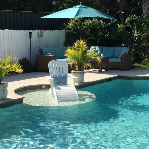 Custom pool with sun shelf from a local custom pool builder