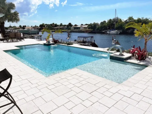 Geometric Pool with sun shelf and water features.