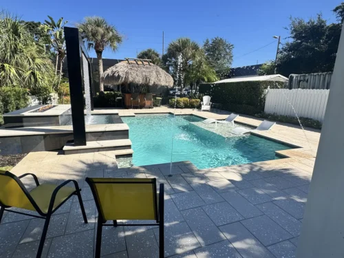 Geometric pool with fire & water features and a sun shelf.