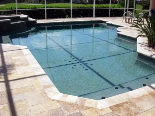 Geometric pool with spillover spa.