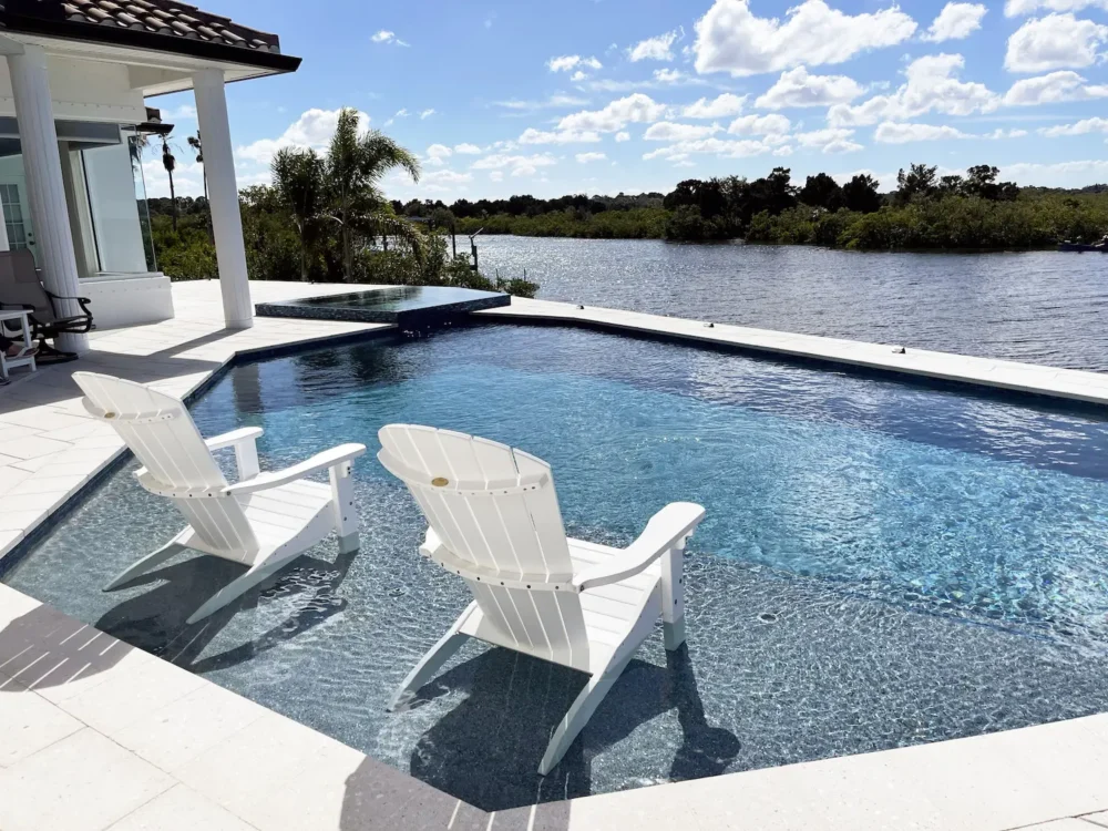 Geometric pool with sun shelf & spa.