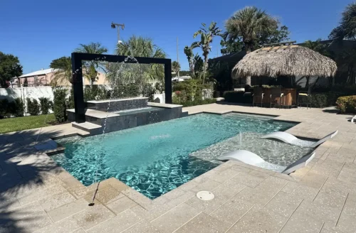 Geometric pool with sun shelf, water & fire features, and tiki bar.