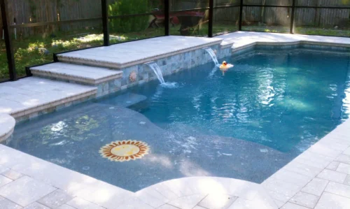 Geometric pool with water feature and sun shelf