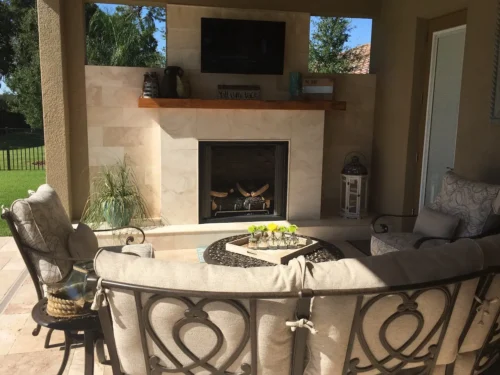 Poolside outdoor fireplace and seating area