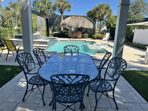 Seating area under pergola.