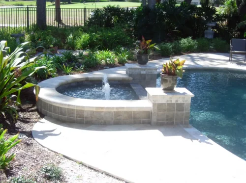 Spillover spa with bubbler, part of a freeform custom pool